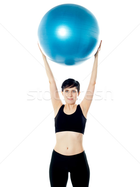 Beautiful woman holding pilates ball Stock photo © stockyimages