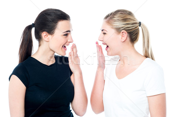 Surprised young girls laughing out loud Stock photo © stockyimages