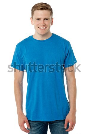 Cheerful calm male model posing in trendy casuals Stock photo © stockyimages