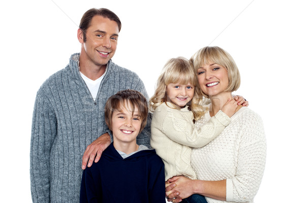 Portrait of friendly family of four in the studio Stock photo © stockyimages