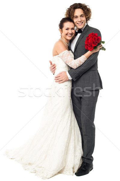 Lovely young married couple embracing warmly Stock photo © stockyimages