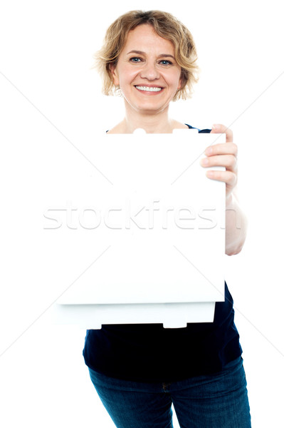 Casual woman holding open pizza box Stock photo © stockyimages