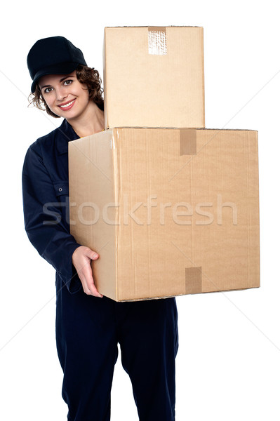 Friendly delivery woman at your doorstep Stock photo © stockyimages