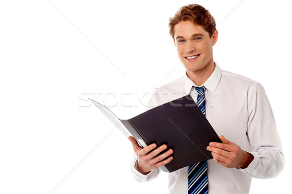 Businessman reviewing office records Stock photo © stockyimages