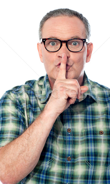 安靜 圖像 英俊 老漢 手指 嘴唇 商業照片 © stockyimages