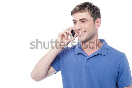 Casual man calling on the cell phone Stock photo © stockyimages