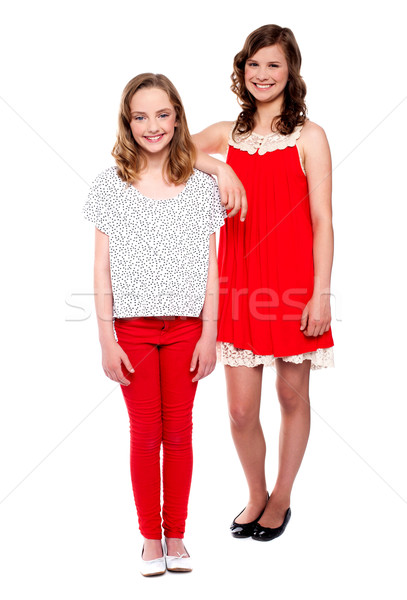 Two young girls posing. Full length shot Stock photo © stockyimages