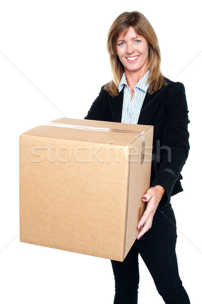 Pretty woman carrying a box Stock photo © stockyimages