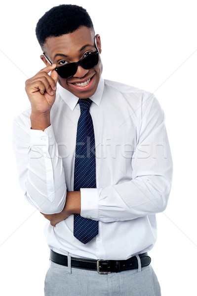Businessman adjusting his sunglasses Stock photo © stockyimages