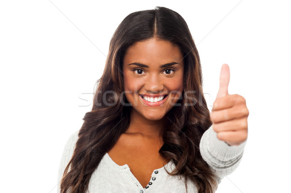 Happy woman with thumbs up Stock photo © stockyimages