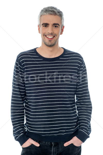 Cheerful young casual man posing Stock photo © stockyimages