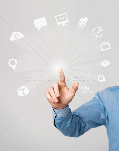 Kéz kiválaszt multimédia ikonok érintőképernyő emberi kéz Stock fotó © stockyimages