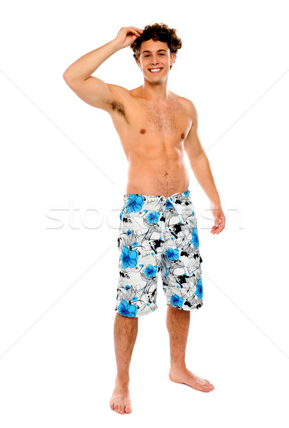 Shirtless muskuläre guy Badeanzug isoliert weiß Stock foto © stockyimages