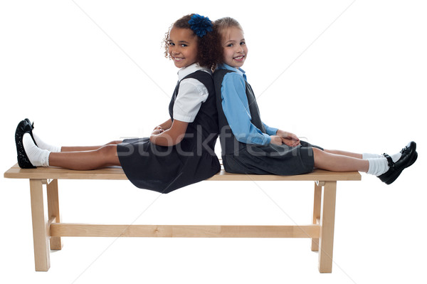 School girls leaning against each other Stock photo © stockyimages
