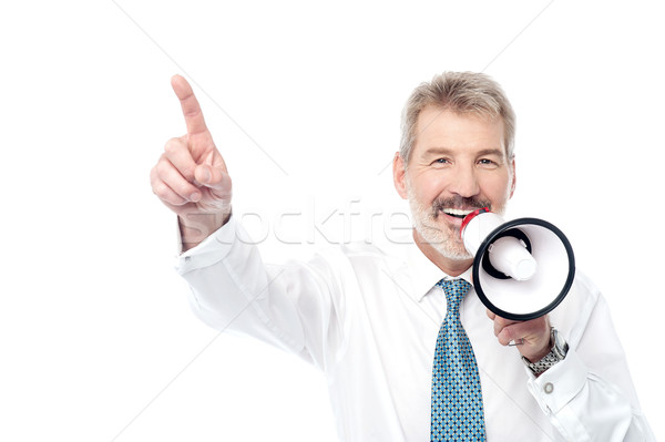Businessman making an announcement by loudhailer Stock photo © stockyimages