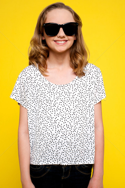 Beautiful girl posando falta óculos de proteção isolado amarelo Foto stock © stockyimages