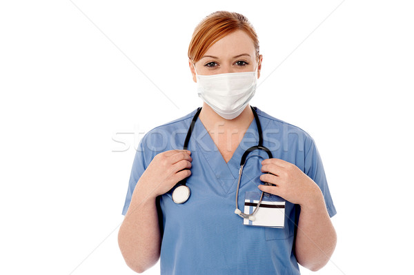 Női sebész visel arc maszk fiatal Stock fotó © stockyimages