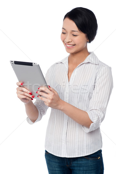 Business woman using touch pad device Stock photo © stockyimages