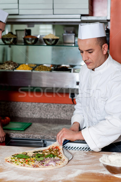 Chef busy in preparing pizza Stock photo © stockyimages