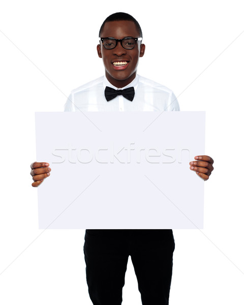 Smiling business representative holding whiteboard Stock photo © stockyimages
