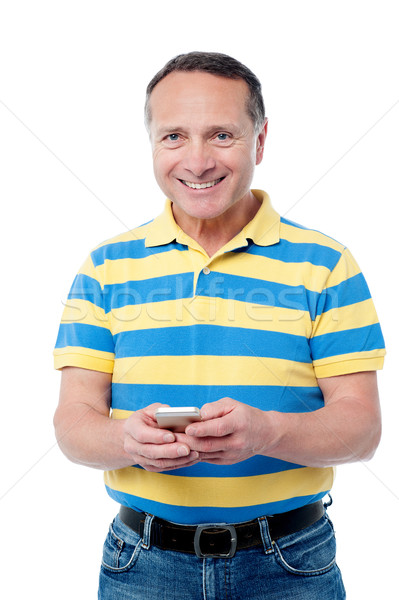 カジュアル 男 携帯電話 幸せ 携帯電話 孤立した ストックフォト © stockyimages
