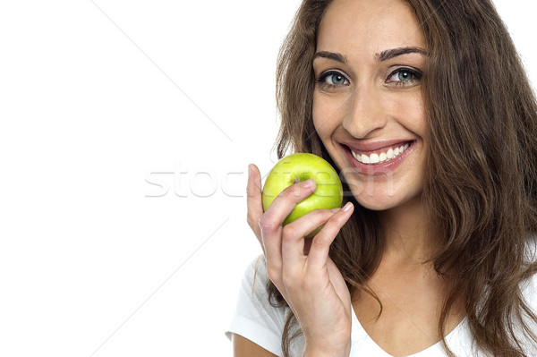 Health conscious woman about to eat fresh green apple Stock photo © stockyimages