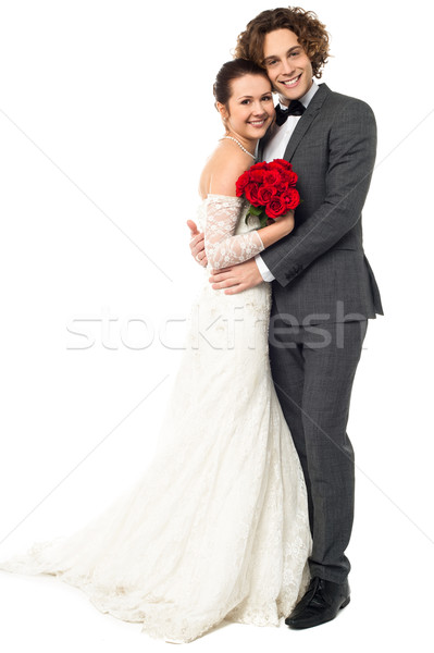 Lovely young married couple embracing warmly Stock photo © stockyimages