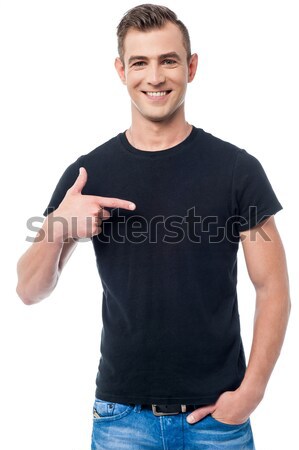 Handsome casual man pointing Stock photo © stockyimages