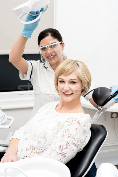 Woman patient sitting at stomatology clinic Stock photo © stockyimages