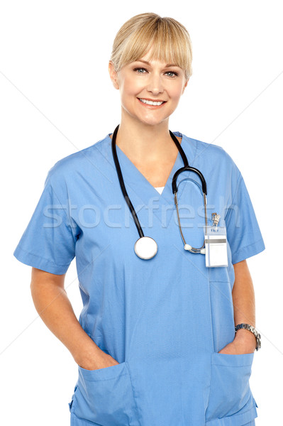 Pretty medical professional posing casually Stock photo © stockyimages