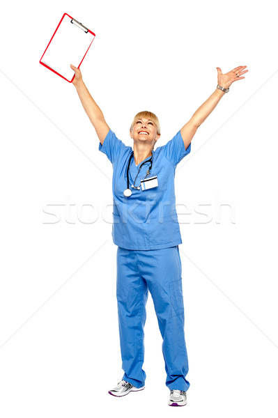 Long shot of a jubilant doctor celebrating her success Stock photo © stockyimages