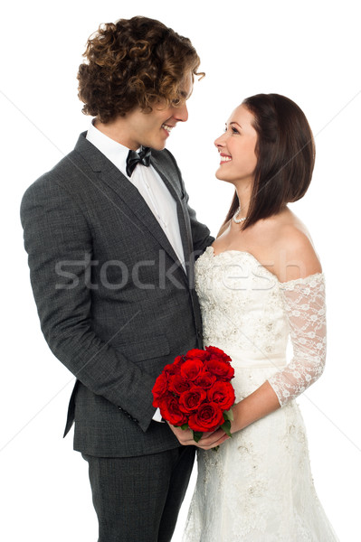 Gorgeous couple gazing into each others eyes Stock photo © stockyimages