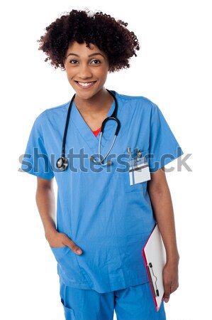 Sorridente senhora médico indicação fora encantador Foto stock © stockyimages