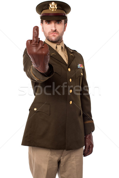 Angry army officer showing middle finger Stock photo © stockyimages