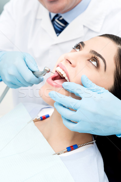 Close up of dental treatment of female Stock photo © stockyimages