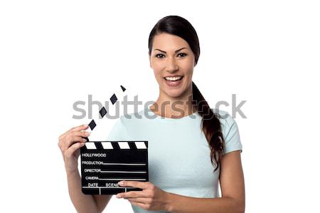 Young girl holding clapperboard Stock photo © stockyimages