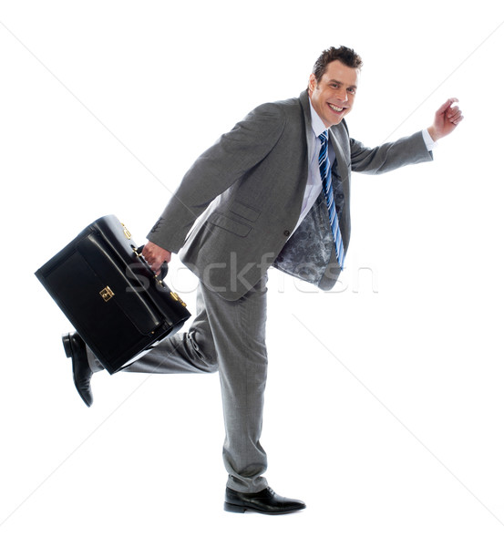 Full length portrait of a businessman running away Stock photo © stockyimages