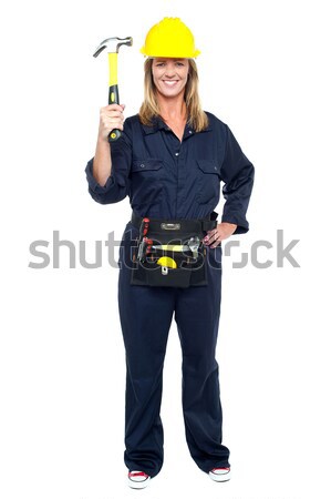 Smiling constrution worker displaying hammer Stock photo © stockyimages