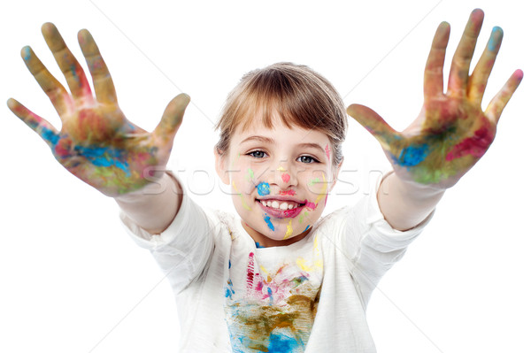 Girl showing colorful hands to camera Stock photo © stockyimages