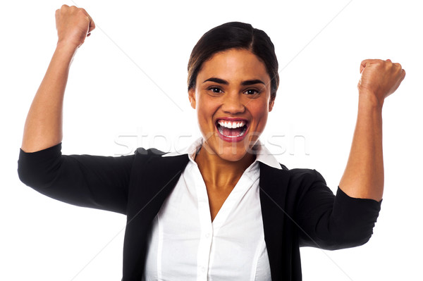 Excited woman with clenched fists Stock photo © stockyimages