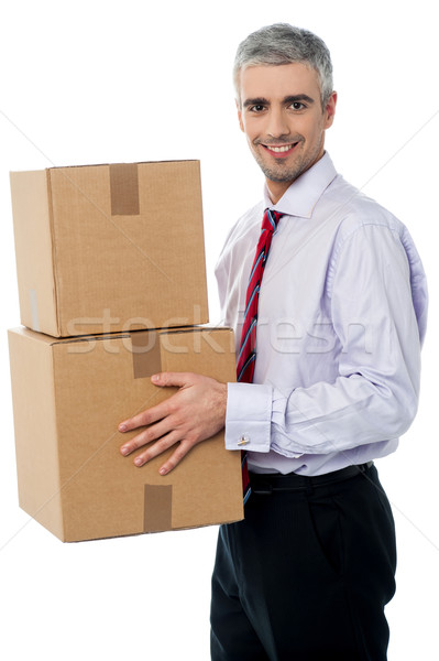 Young corporate man holding card box Stock photo © stockyimages
