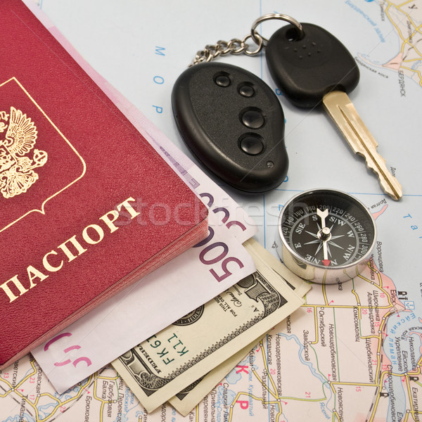 Passport with money, map,Car key, keychain,compas Stock photo © stokato
