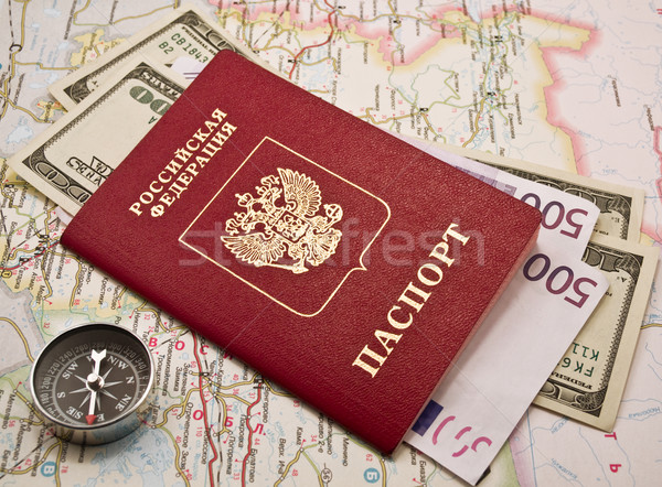 Passport with money and compass on  map Stock photo © stokato