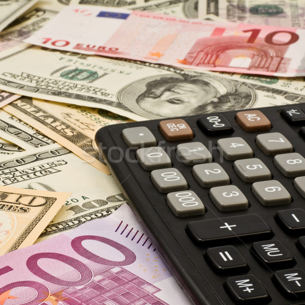 Calculator on  Dollars and euro Stock photo © stokato