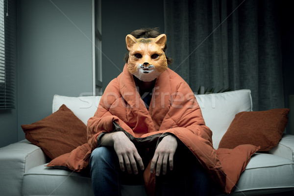Férfi róka maszk fiatalember visel ül Stock fotó © stokkete