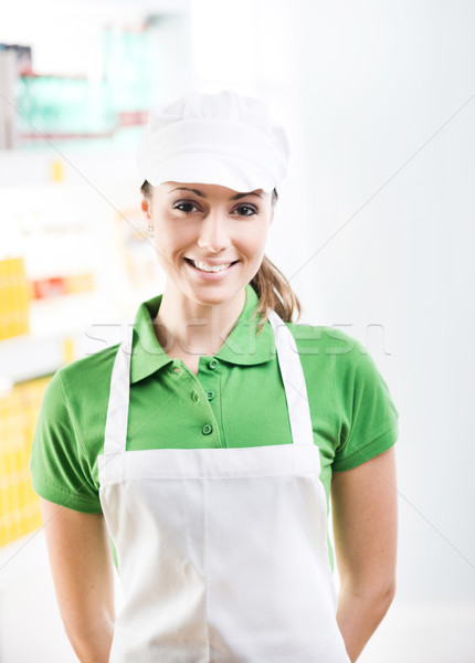 Female sales clerk working at supermarket Stock photo © stokkete