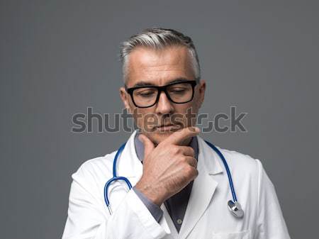Capo medico posa grigio medicina sanitaria Foto d'archivio © stokkete