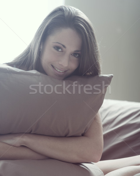 édes reggel ébren fiatal nő átkarol párna Stock fotó © stokkete