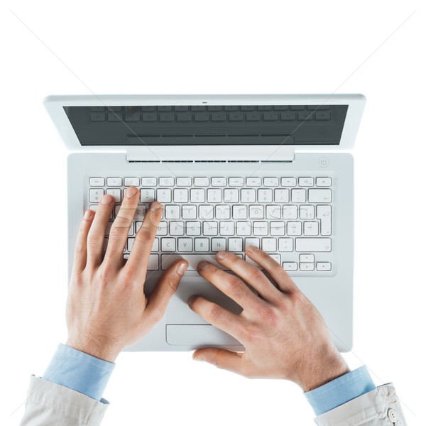 Businessman typing on a laptop Stock photo © stokkete