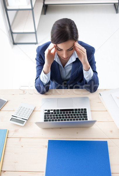 Businesswoman having an headache Stock photo © stokkete